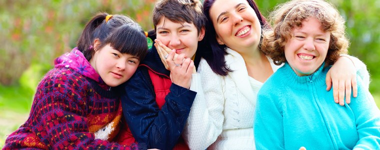 group of happy women with disability having fun in spring park